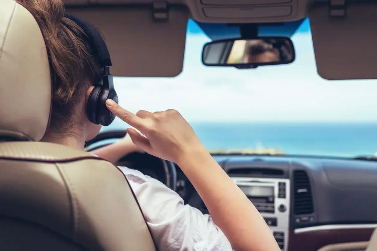 https://wsa-website-assets.s3.amazonaws.com/assets/images/Wearing-Headphones-While-Driving.webp